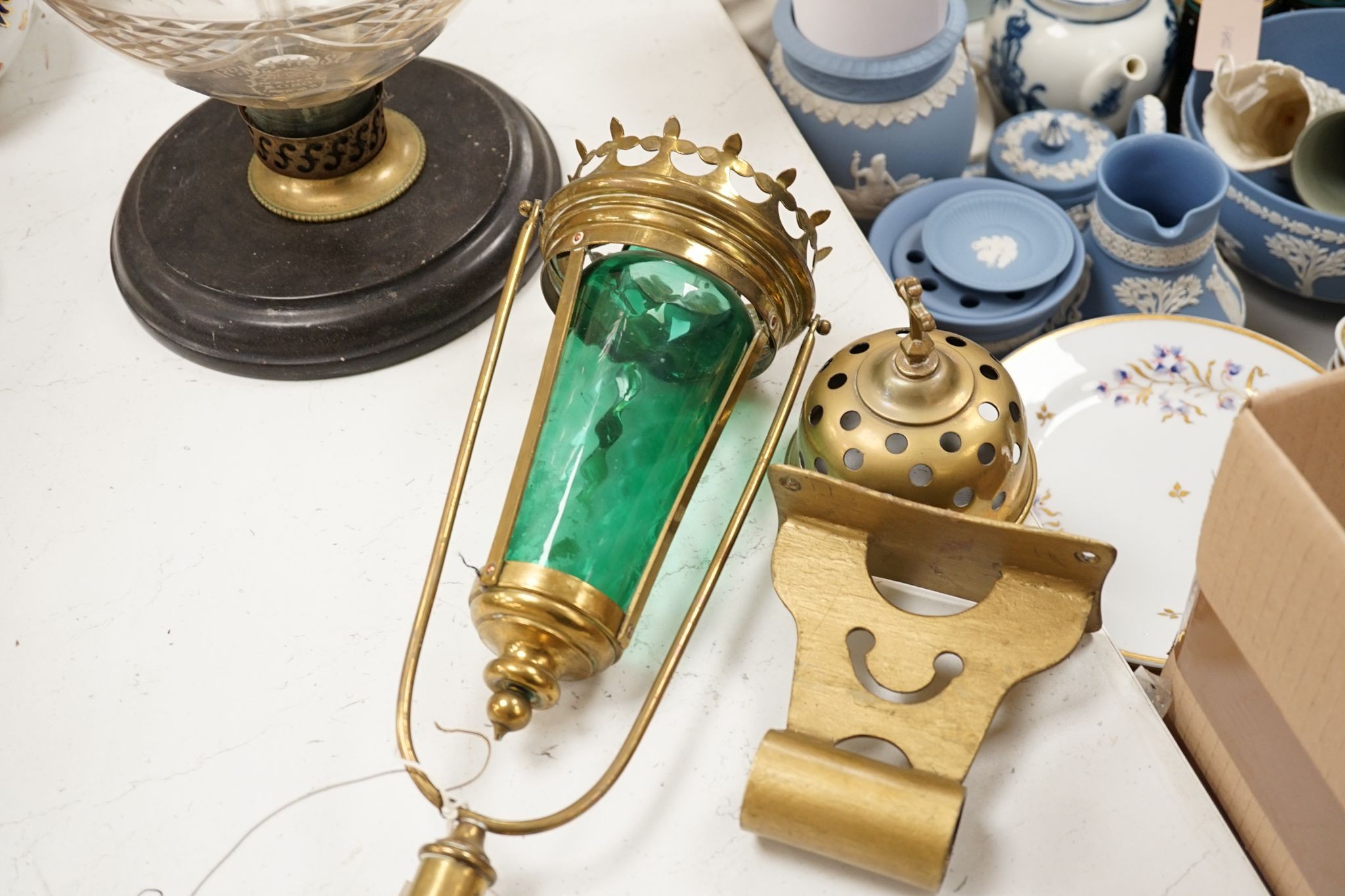 A brass and green glass processional lantern, with docking port, 90 cms high.